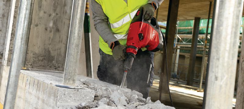 Breaking concrete with a hammer drill