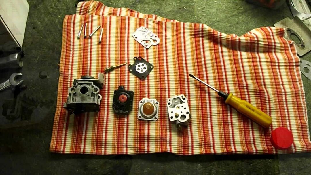 Disassembled trimmer carburetor