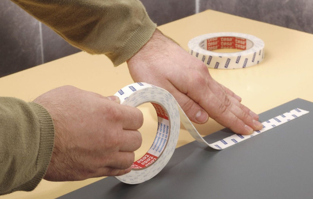 Use of double-sided tape.