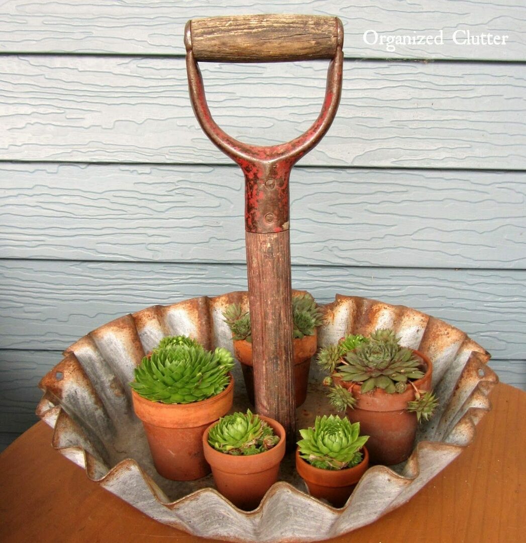 plant stand made from an old shovel