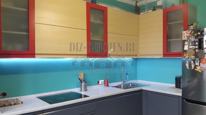 Elegant modern gray kitchen with red modules
