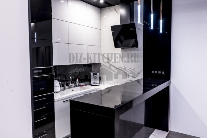 Black and white glossy kitchen with black bar counter