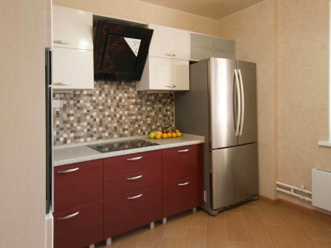 Red and white kitchen with large refrigerator