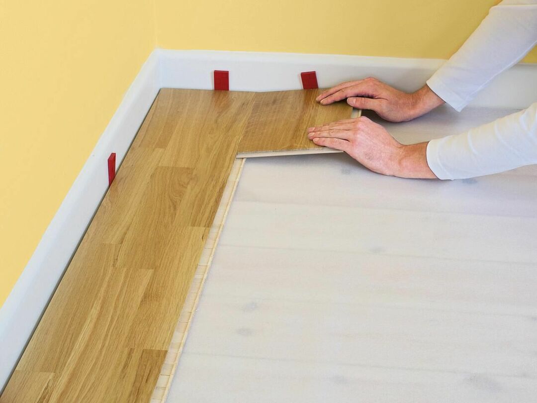 Installation of the first laminate panel