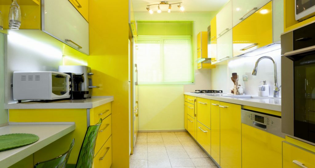 Yellow kitchen in the interior 