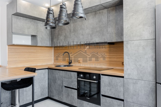 Gray loft kitchen with wood