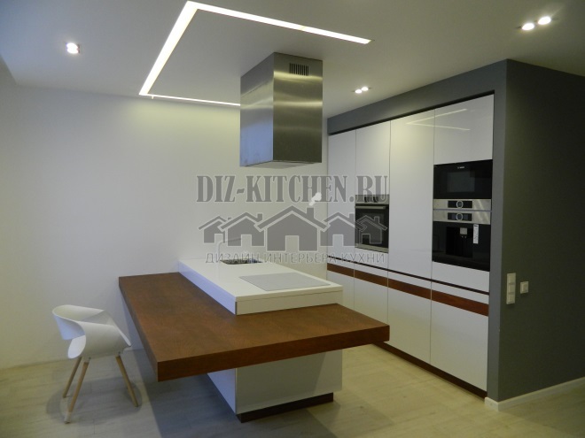 Modern white glossy kitchen with hidden fronts