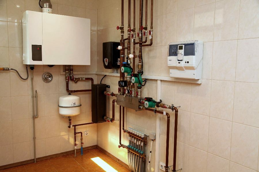 Wall mounted gas boiler in boiler room