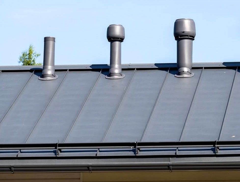 Pipes of various configurations on the roof