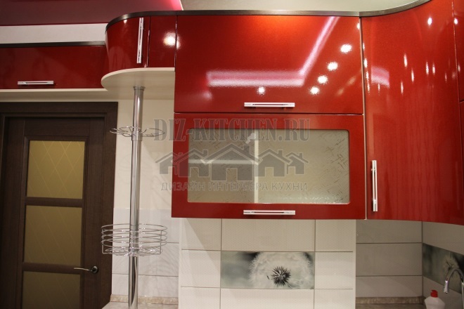 Red kitchen with white center and curved fronts