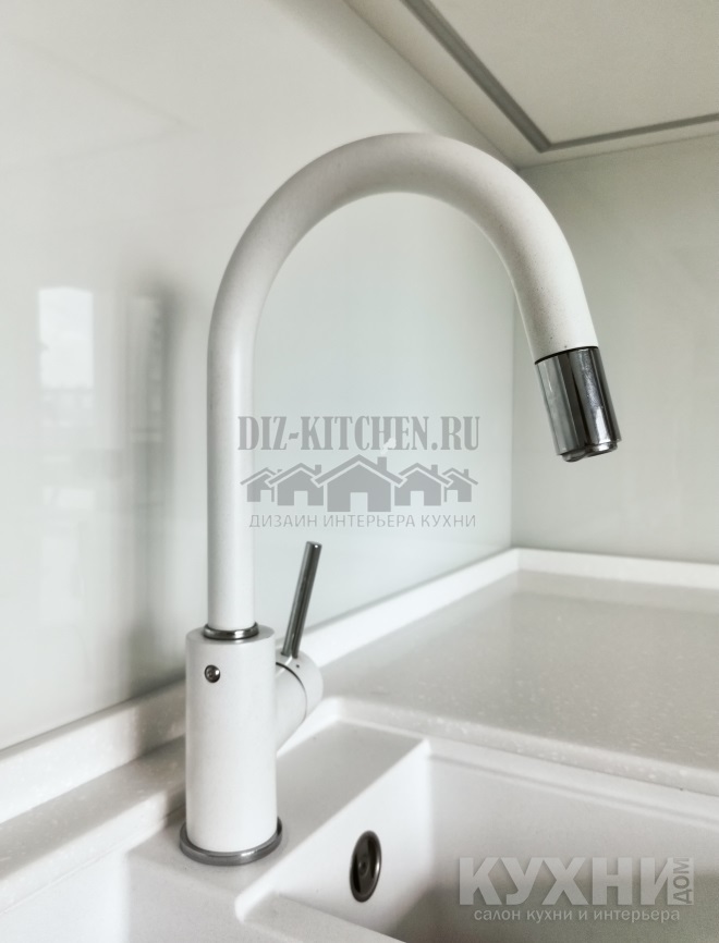 White faucet in the color of the countertop