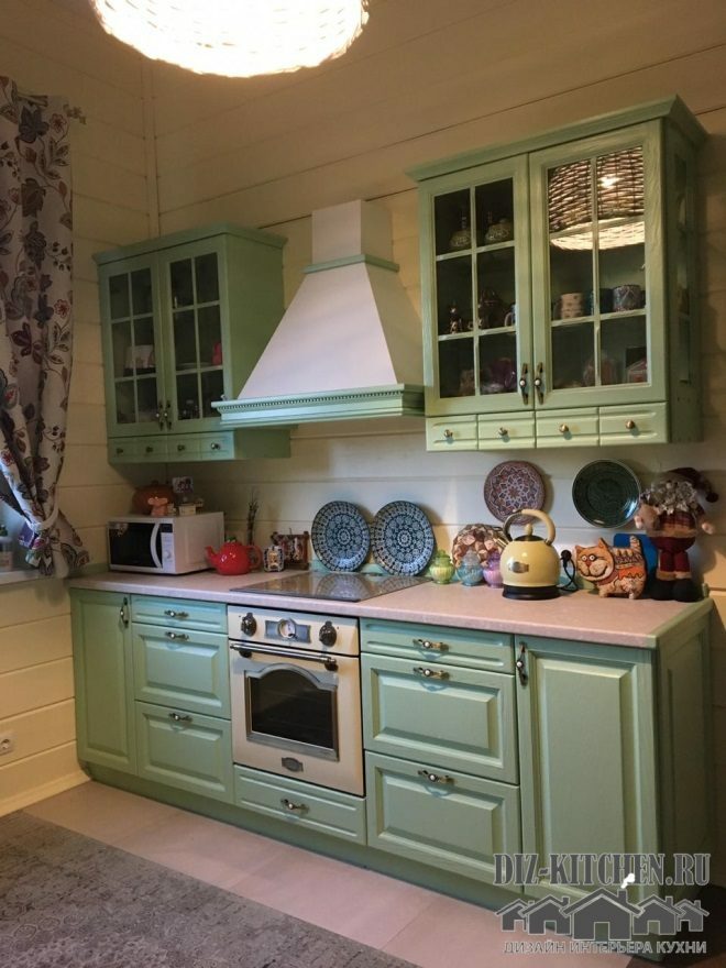 Provence style pistachio kitchen with dining area