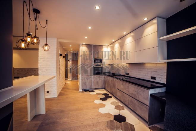 Loft stílusú konyha beton megjelenésű homlokzatokkal és bárral