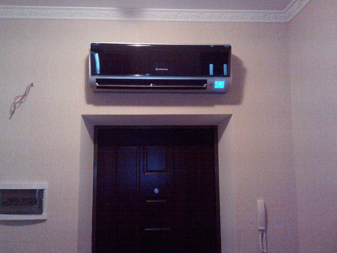 Air conditioner installed above the front door