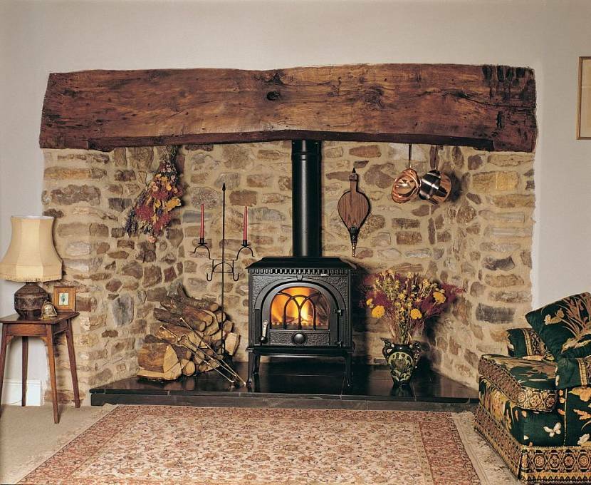 The walls by the fireplace are lined with stone