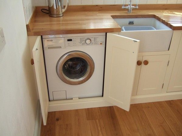 Hur man integrerar en tvättmaskin i köket: vi bestämmer platsen för installation, installation