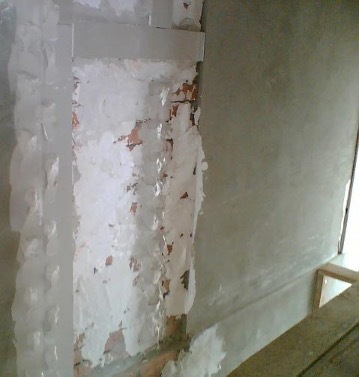 Gluing drywall to walls