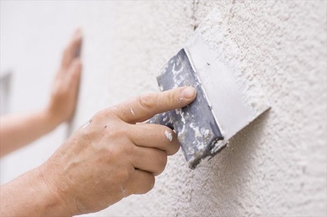 Do you need finishing putty on walls for wallpaper?