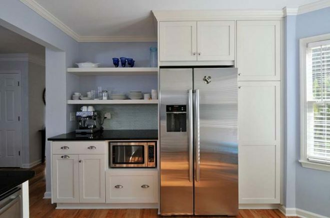 The microwave oven is built into the kitchen set