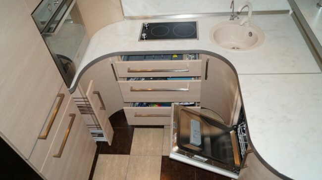Beige kitchen with a U-shaped layout, bar counter